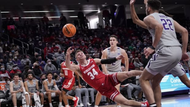 Jan 18, 2022; Evanston, Illinois, USA; Wisconsin Badgers guard Brad Davison (34) shoots the ball against the Northwestern Wildcats during the first half at Welsh-Ryan Arena. Mandatory Credit: David Banks-USA TODAY Sports
